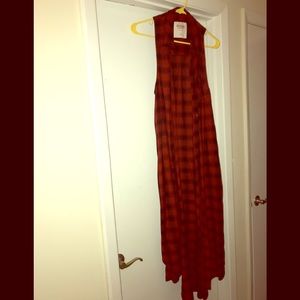Long red and black sleeveless cardigan